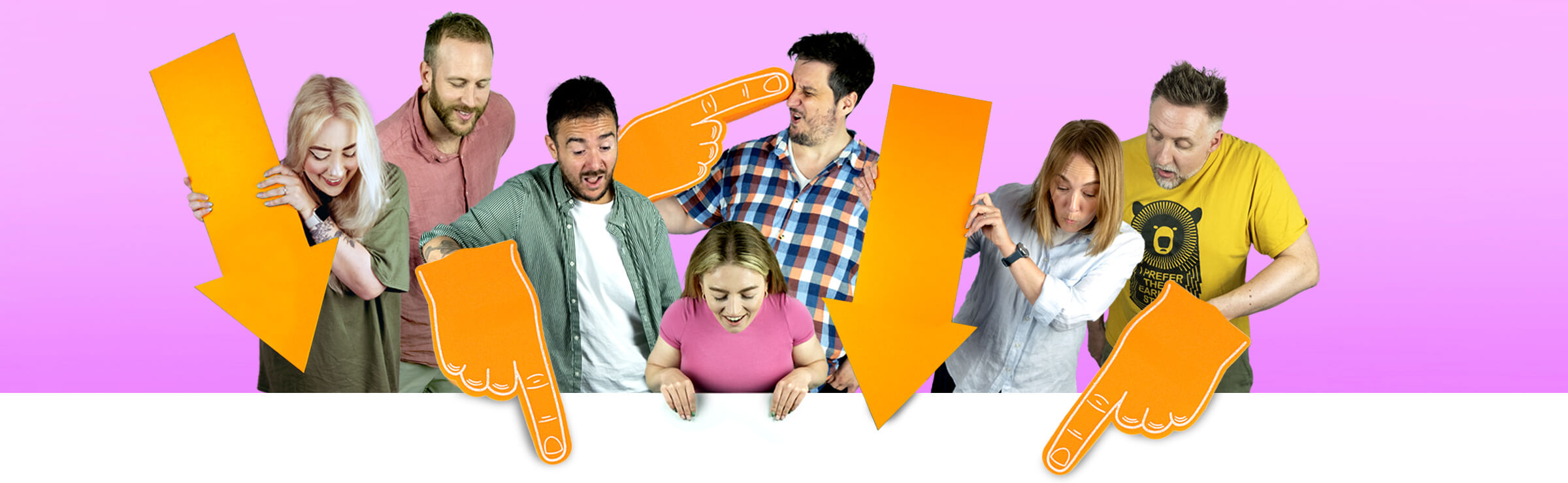 A group of people with novelty foam hands stood in front of a pink background.